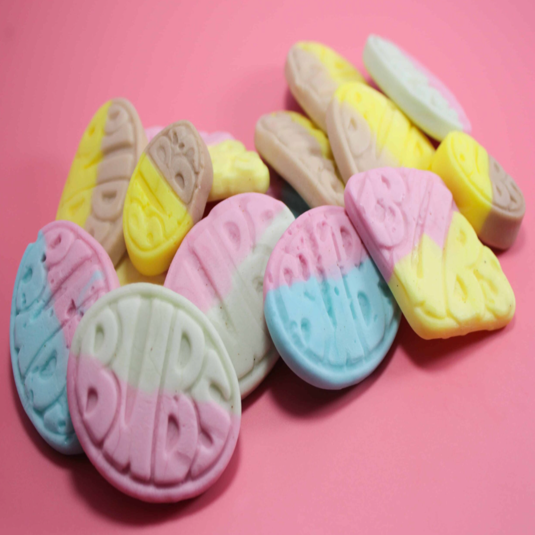 Colorful oval-shaped BUBS on a pink background