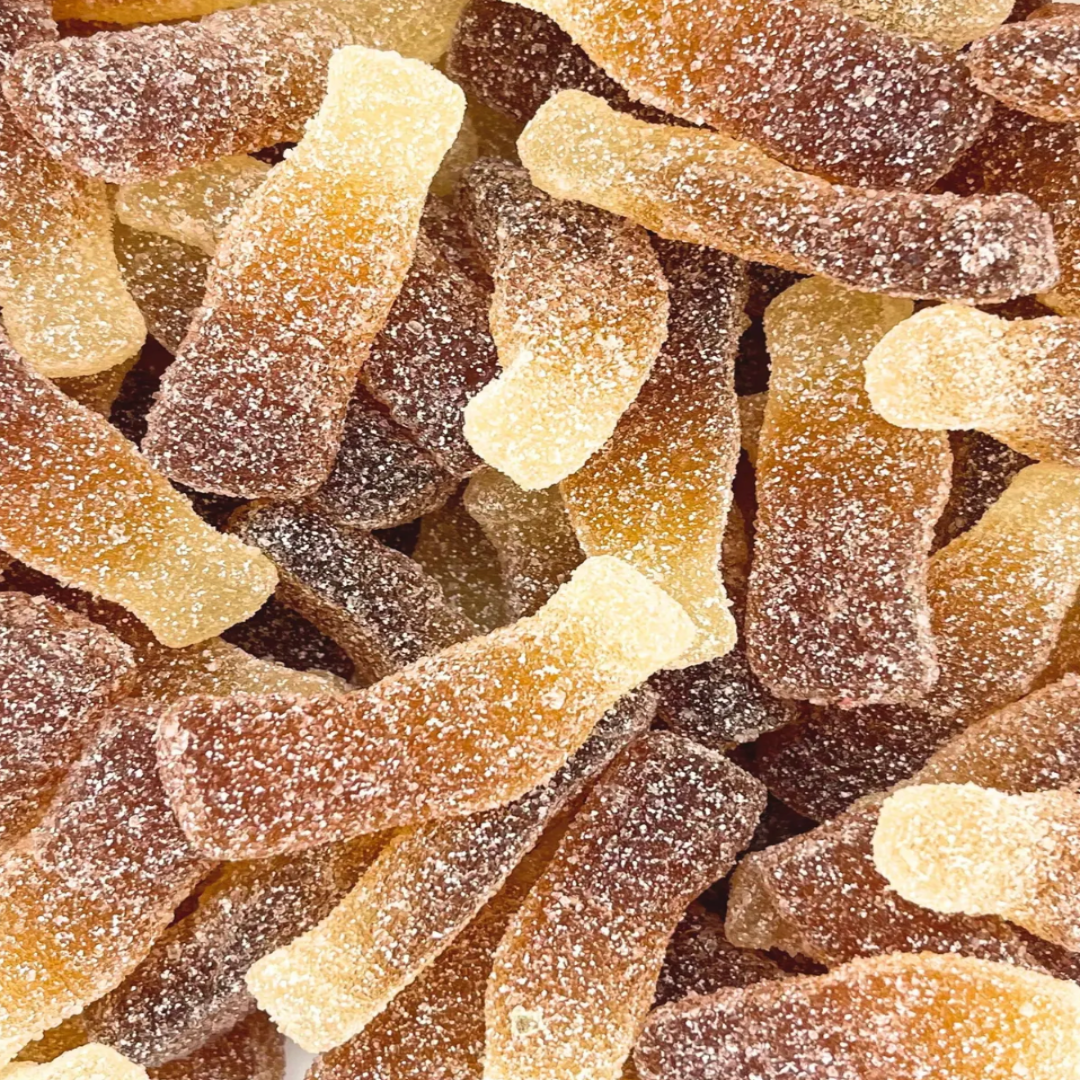 Close-up of a pile of sugared shaped bottle candies.