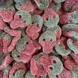 Close-up of colorful jelly candy shaped like skulls.