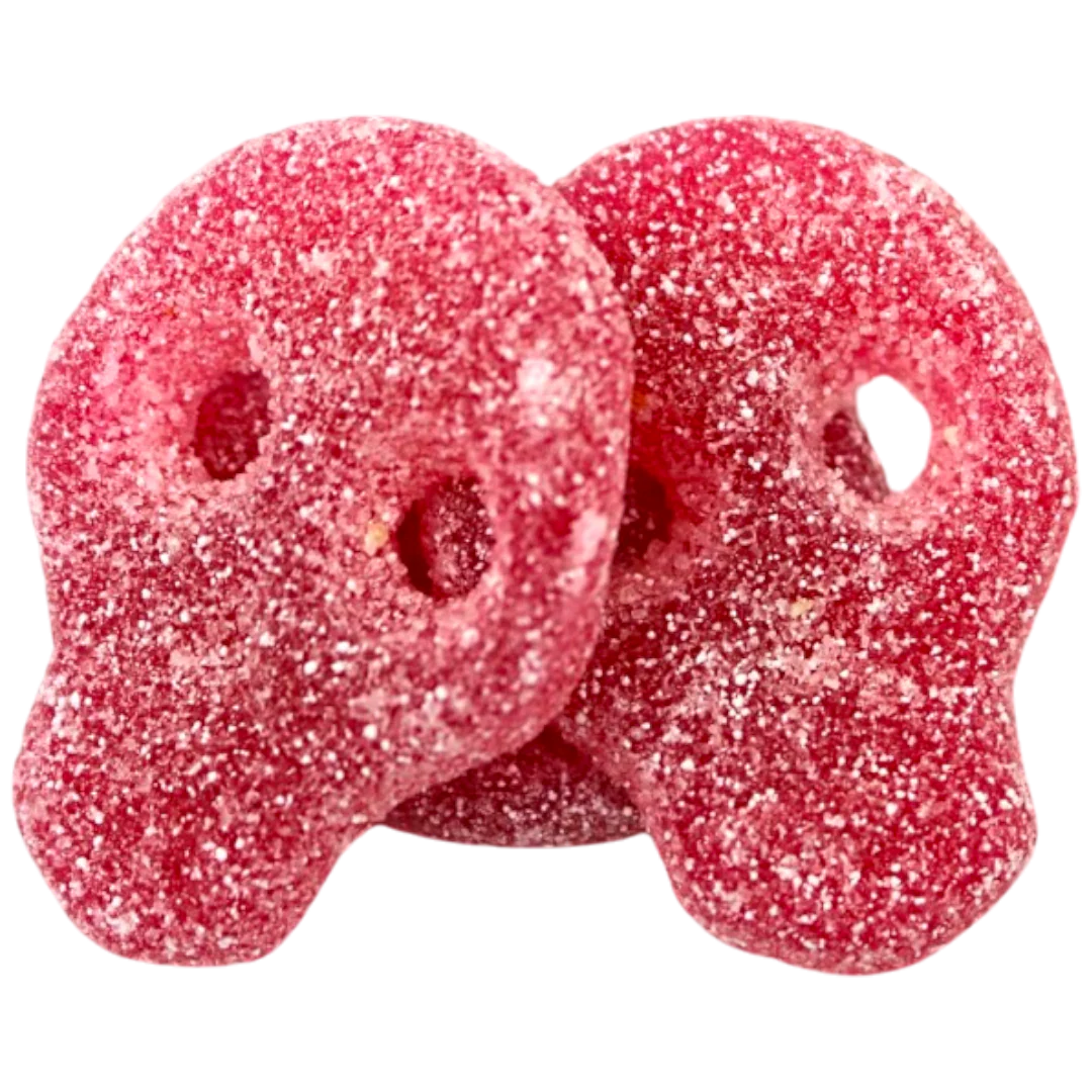 Two Red gummy skull candy covered in sweet and sour sugar.