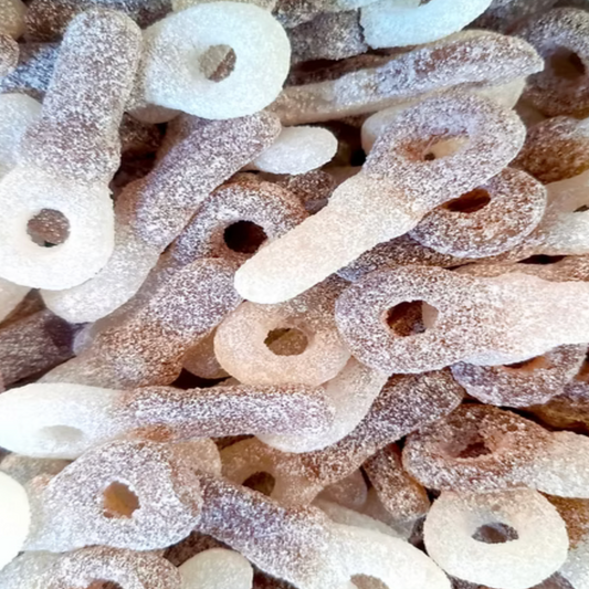 Close-up of assorted sugary candy pieces  pacifier shapes.Covered in sour sugar.