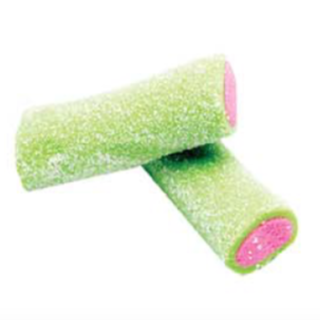 Close-up of two green and pink candy stubs with pink center. Coated in sour sugar with a blurred background