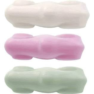 Three marshmallow in white, pink, and green on a white background