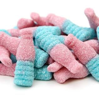 Pink and blue gummy shaped as a bottle on a white background