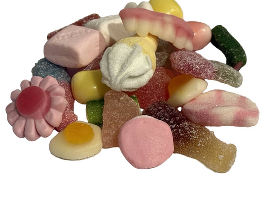 Assorted colorful gummy candies on a white background