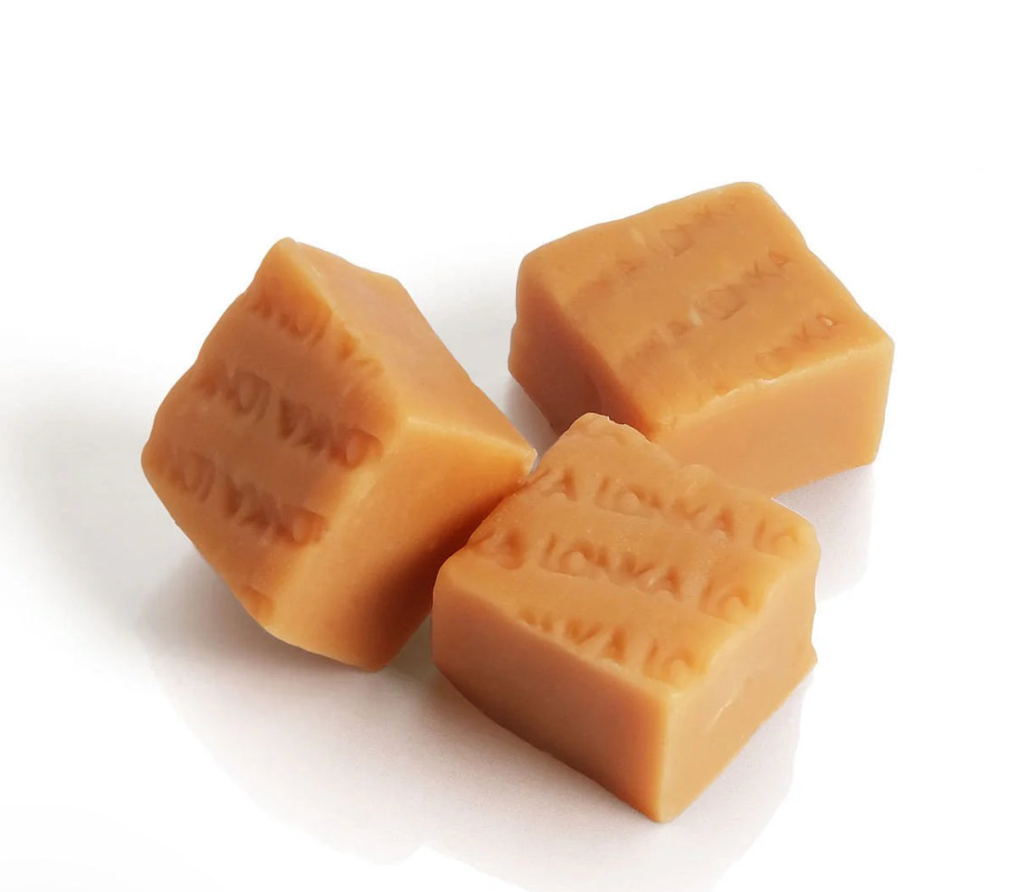 Three pieces of fudge caramels on a white background. Marked Lonka. 