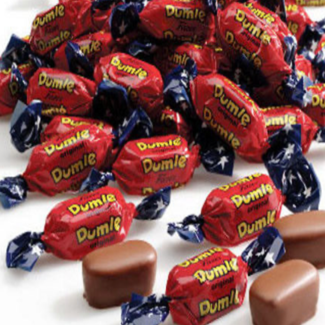 Dumle candies in red wrappers with blue stars on a white background