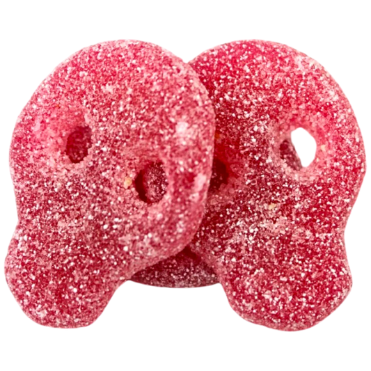 Two Red gummy skull candy covered in sweet and sour sugar.