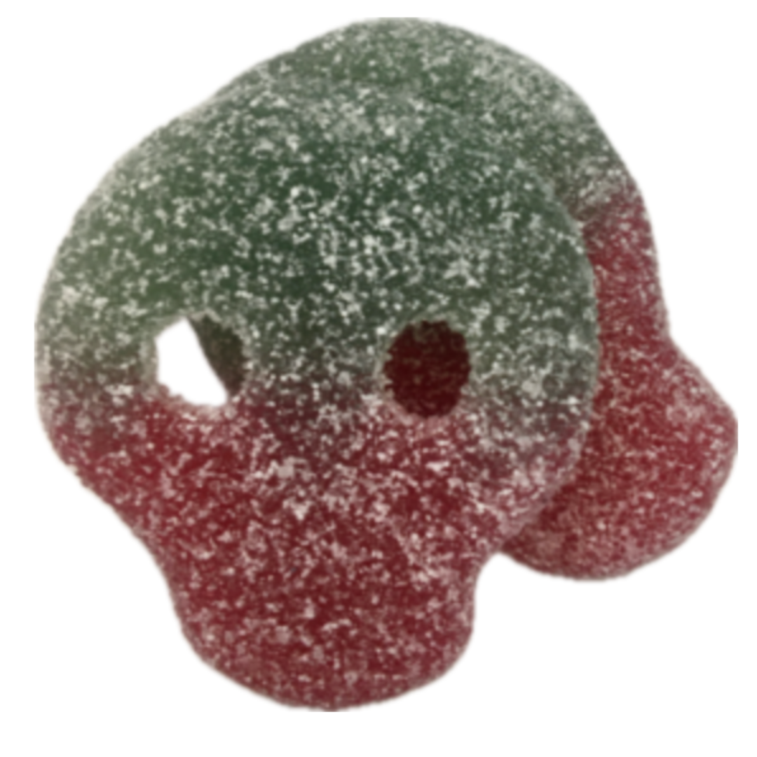 Gummy candy shaped like a skull with green and red colors on a white background