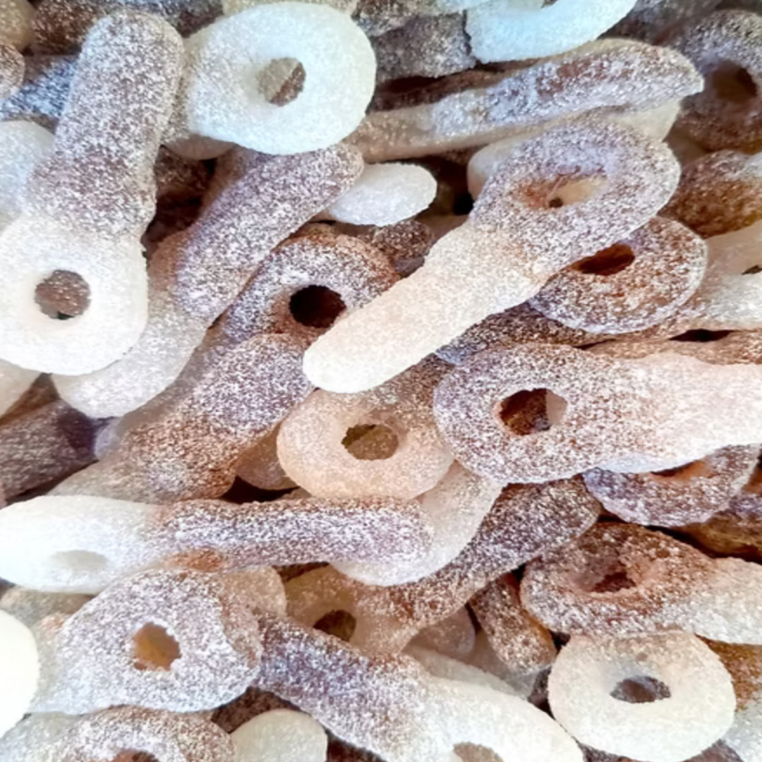 Close-up of assorted sugary candy pieces  pacifier shapes.Covered in sour sugar.