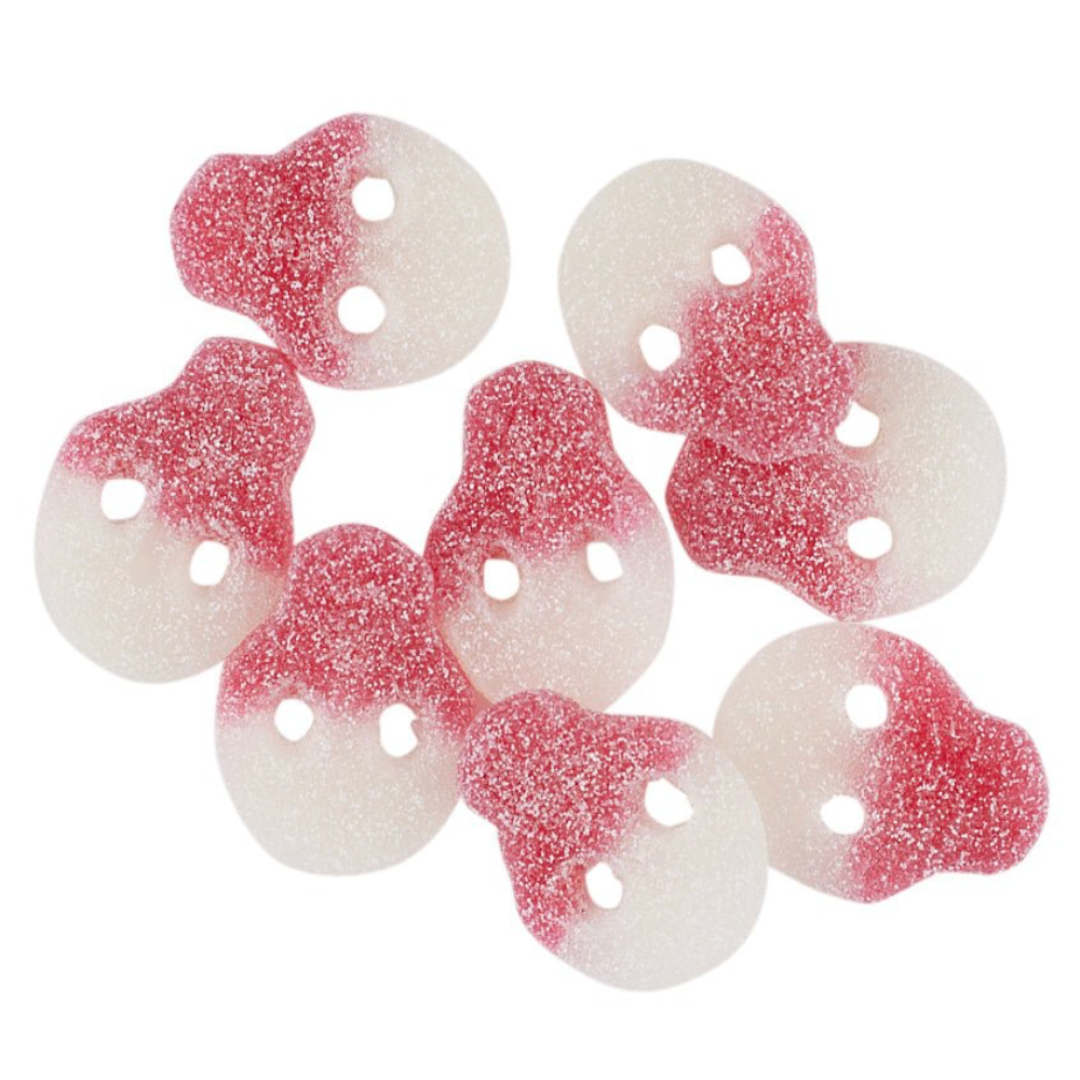 Red and white gummy candy shaped as skulls on a white background
