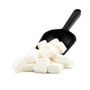 Black scoop filled with white marshmallows on a white background
