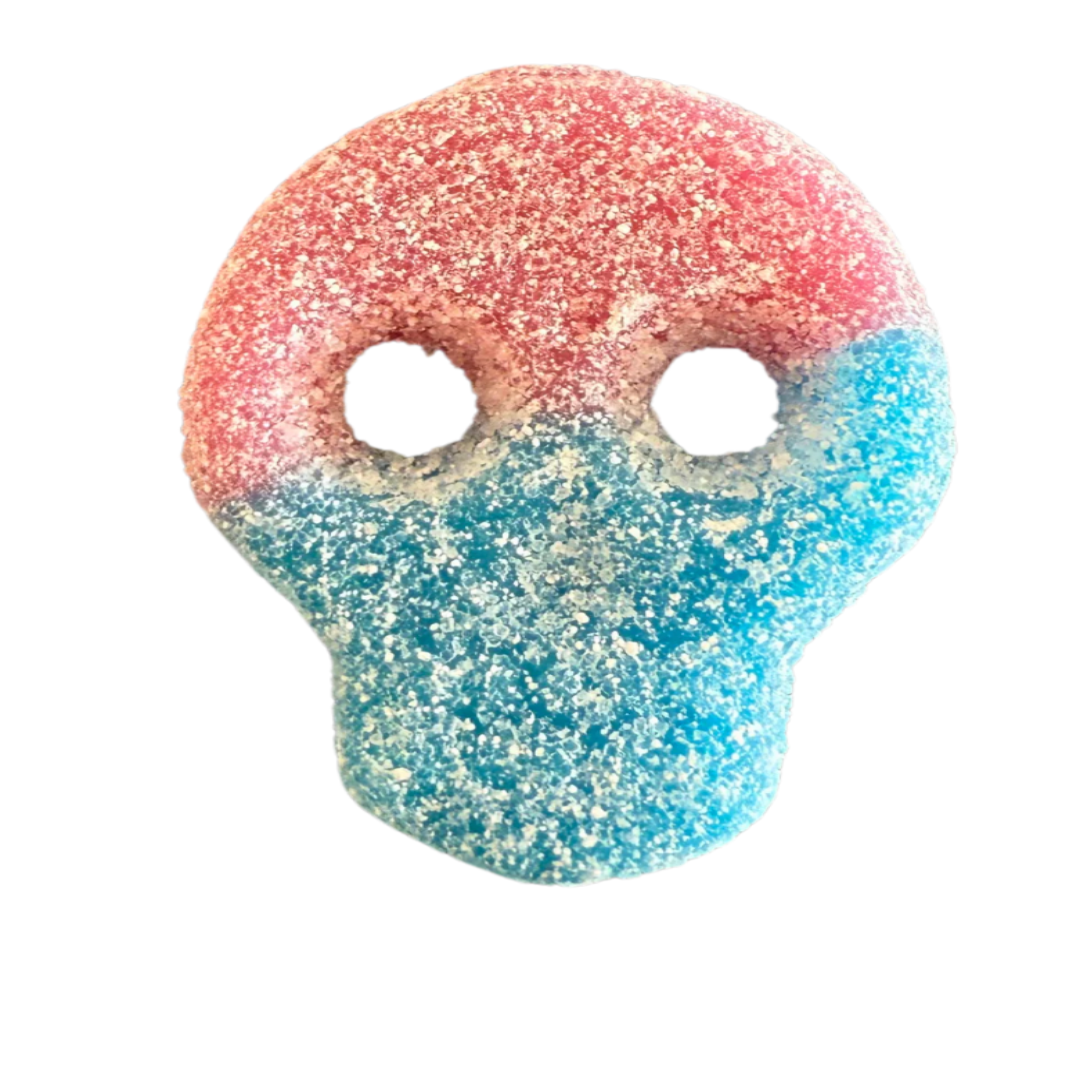 Red and Blue candy shaped as a skull with two eyes no mouth. Covered in white sour sugar. Soft and chewy. White back ground. Viral Trendy Candy swedish.