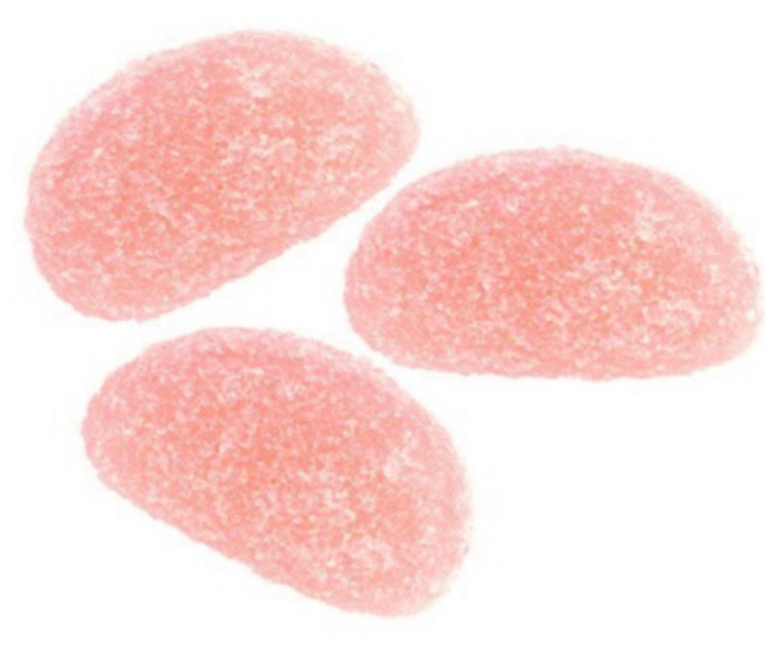 Three pink jelly beans on a white background