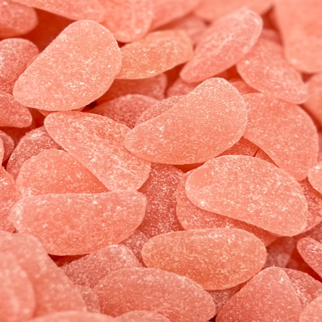 Close-up of pink gummy candies with a soft focus background